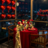 Red Romance Dinner ✨ A luxury romantic dinner setup with a stunning night view and elegant red touches ❤️ Includes red heart balloons, elegant floral styling, warm lighting, and a beautifully arranged table for unforgettable moments.